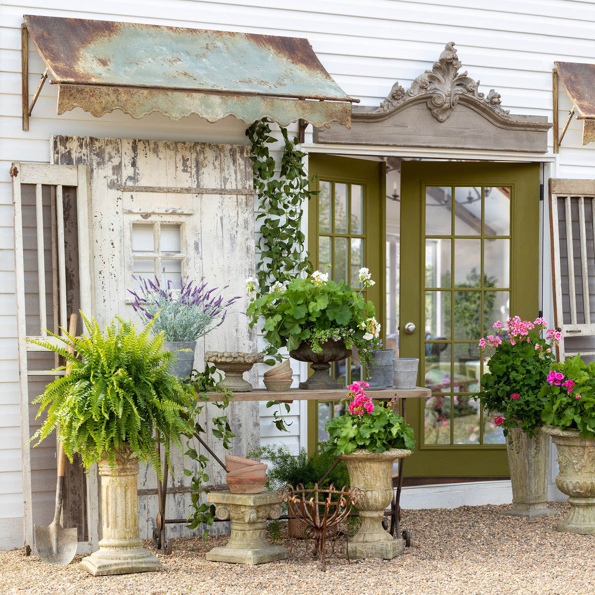 decorative-wood-pediment-outside-decor-on-garden-shed-over-green-door-with-plants