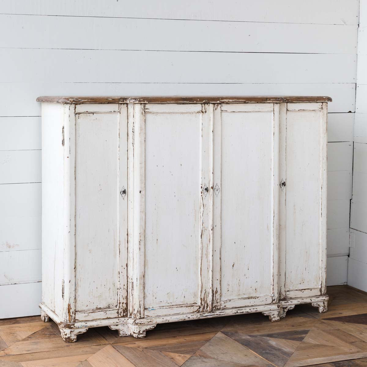 Rustic-painted-white-grand-entrance-cabinet-on-white-wall