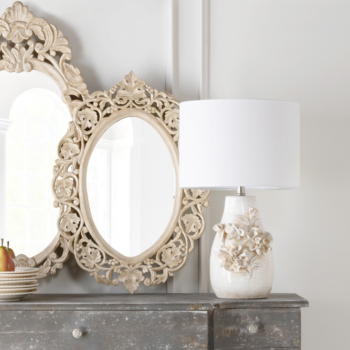 white ceramic table lamp on grey washed buffet with mirrors