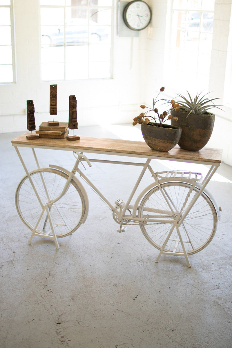 rustic bike shelf for props and displays with plants and decor clock