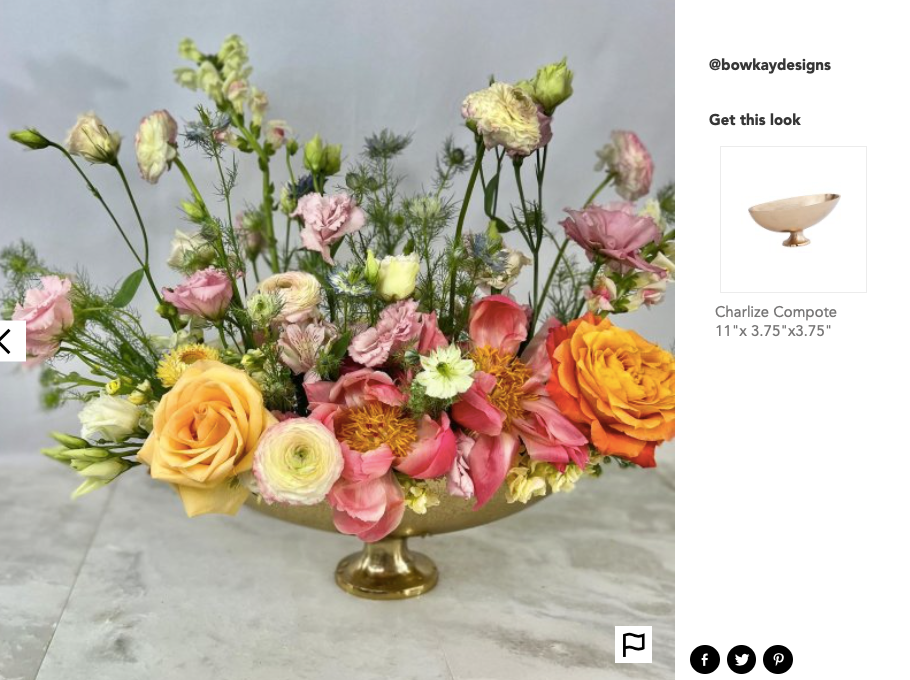 gold aluminum vase compote full of a colorful flower arrangement of peonies roses and lisanthus 