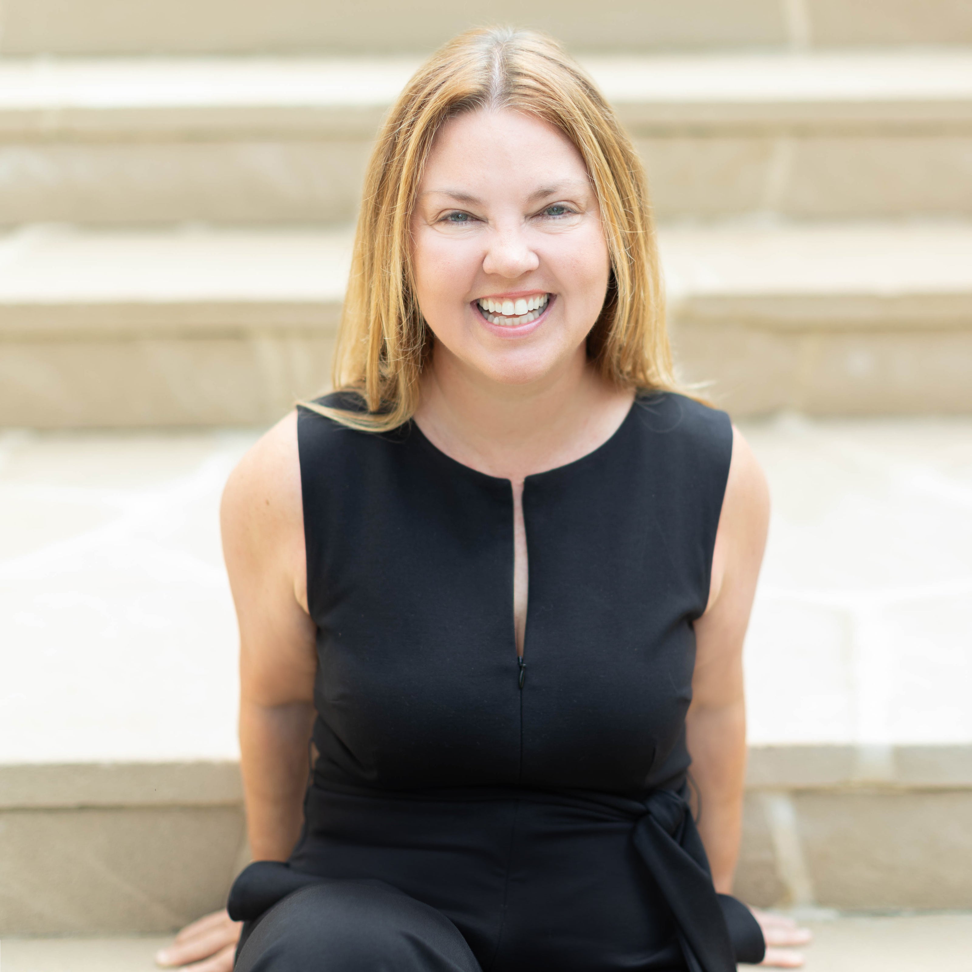 photo of christy griner luxury florist in black top on the steps of the cherokee town and country club in atlanta georgia 