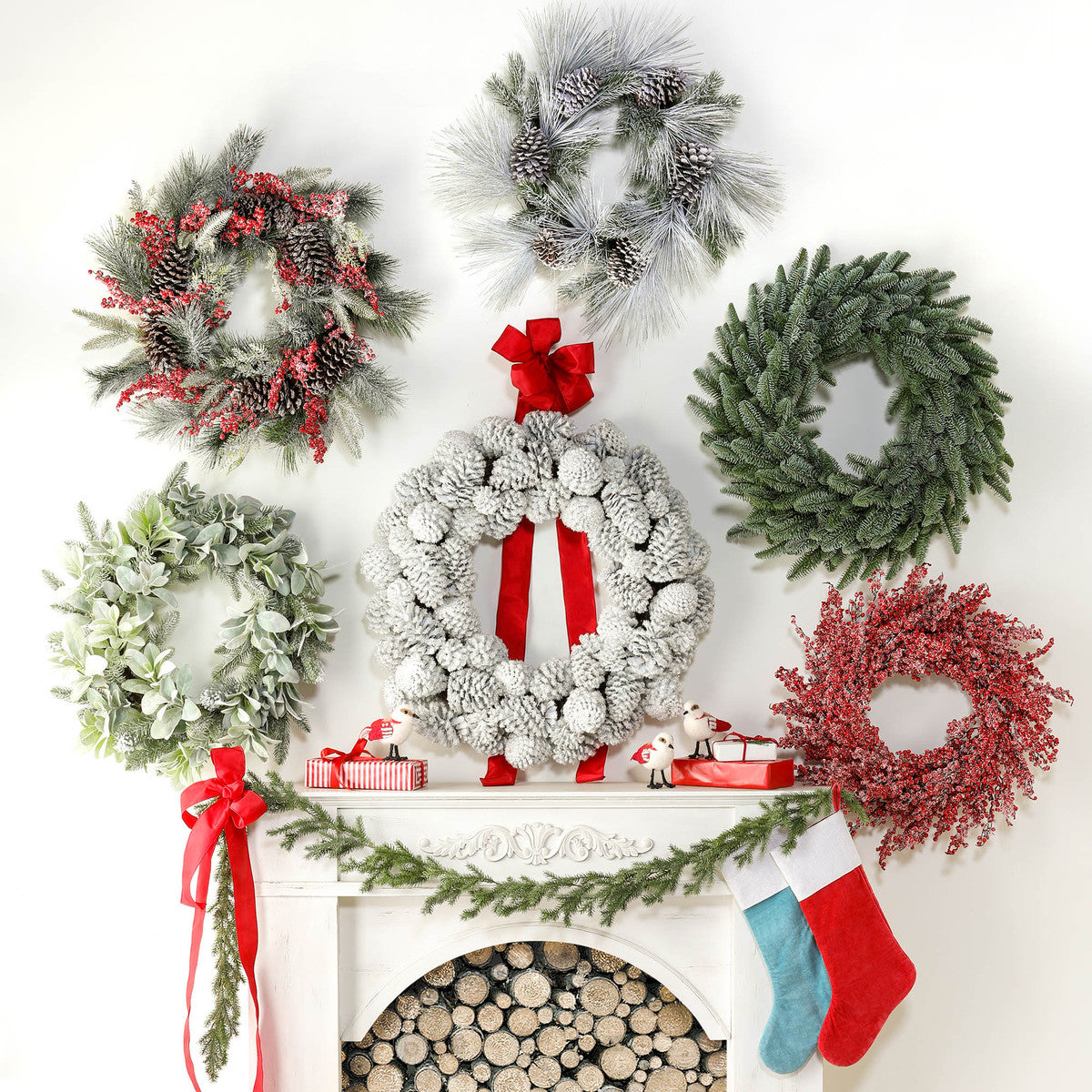 six holiday wreaths above a festive mantel on a white wall