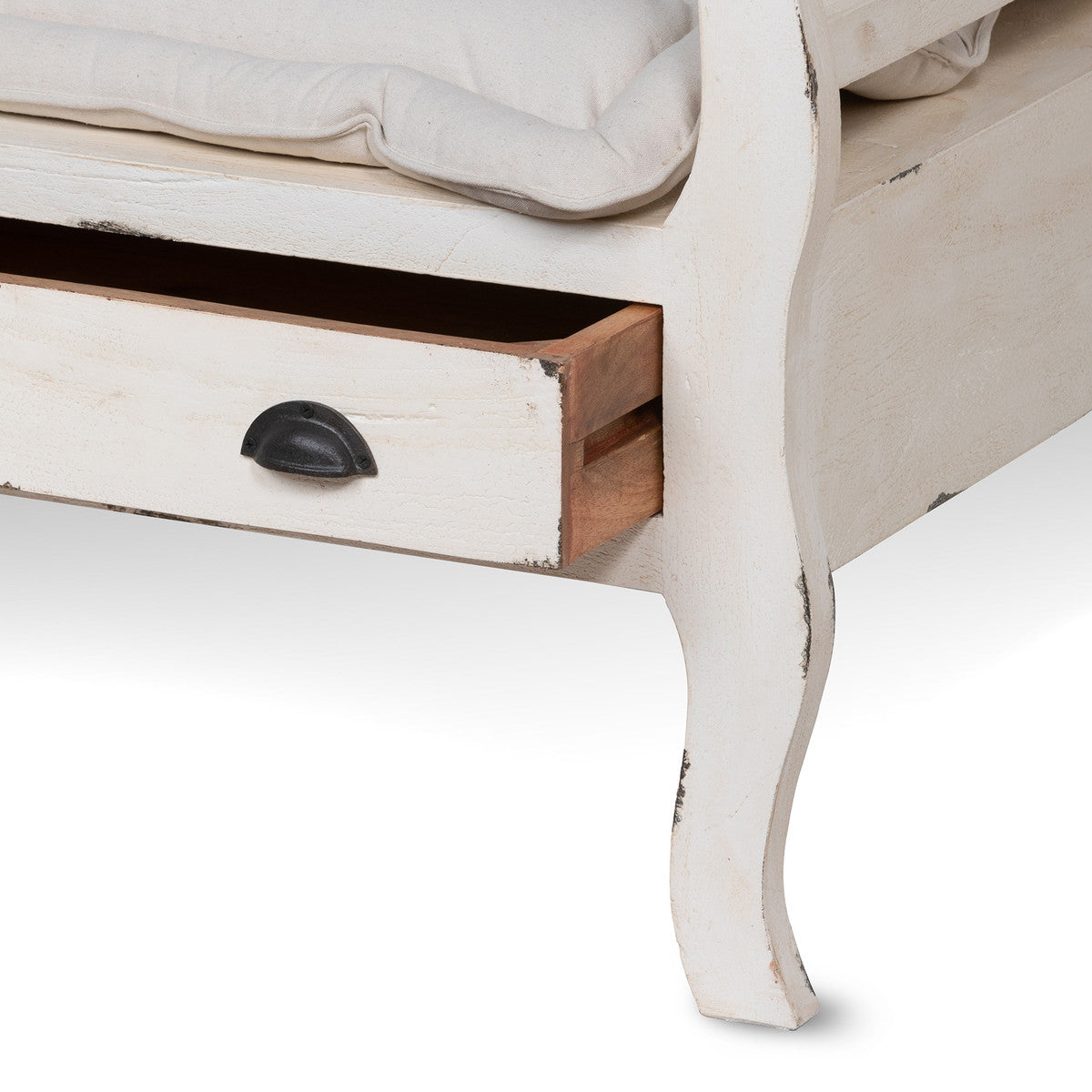 detail shot of drawer on french country white washed wood bench with drawers and cotton cushion 