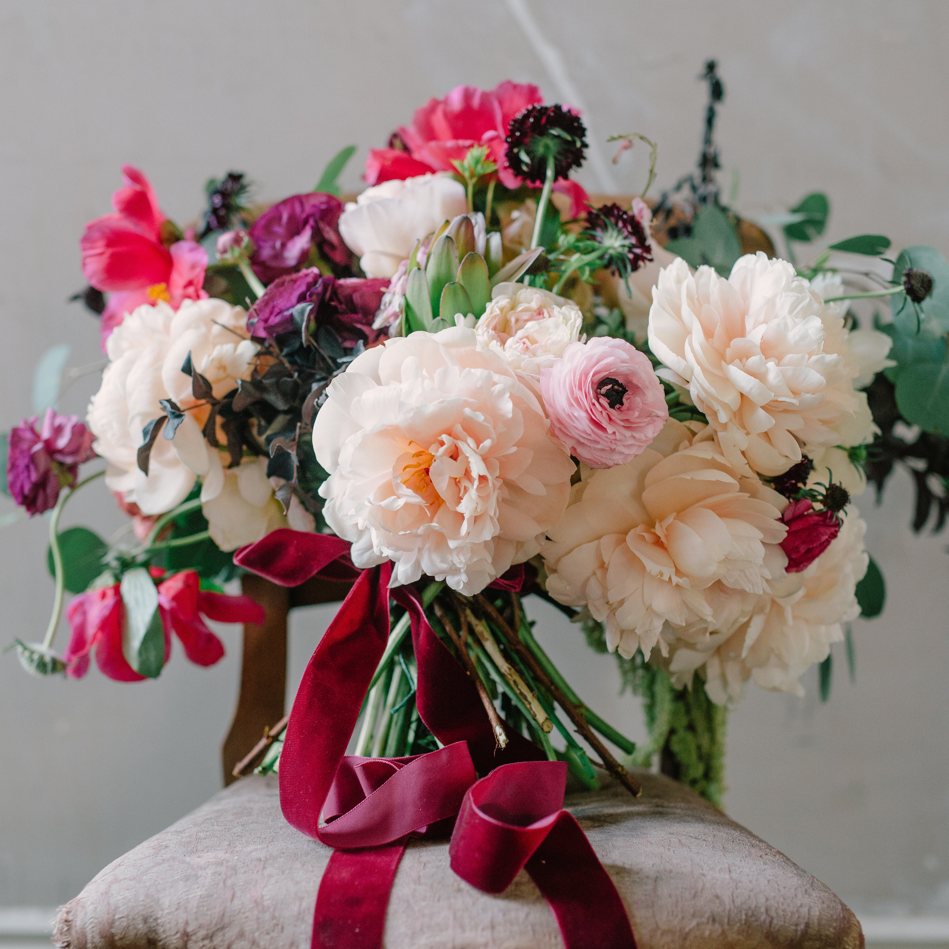 luxury bloom flower bouquet of peonies garden roses ranunculus and velvet ribbon 