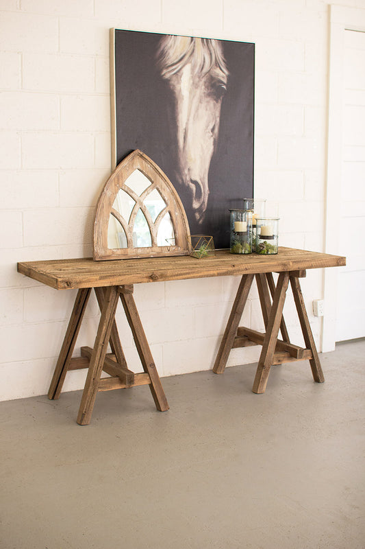 recycled wood table styled with a mirror and large photo of horse plus air plants and candles