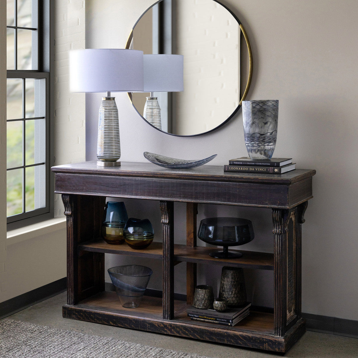 urban style ribbed table lampon a wood console with mirror