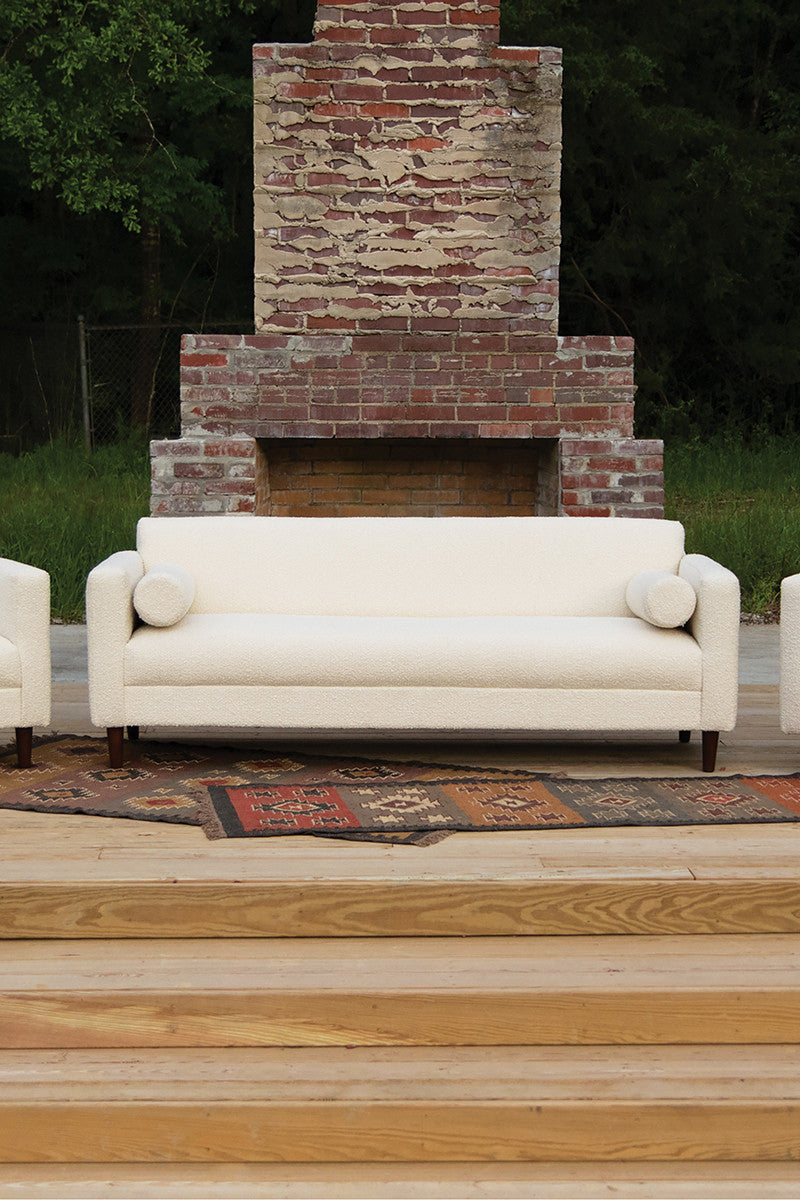 modern white sofa brick fire place 