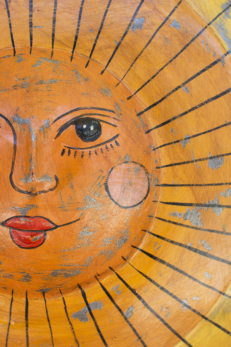 close up of metal sun wall art 