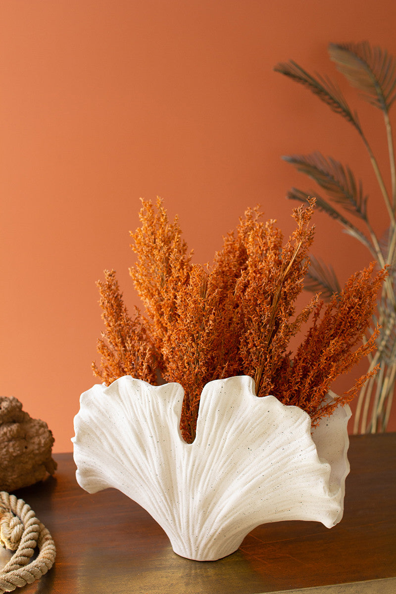 white-sea-coral-vase-with-orange-flowers-on-orange-wall