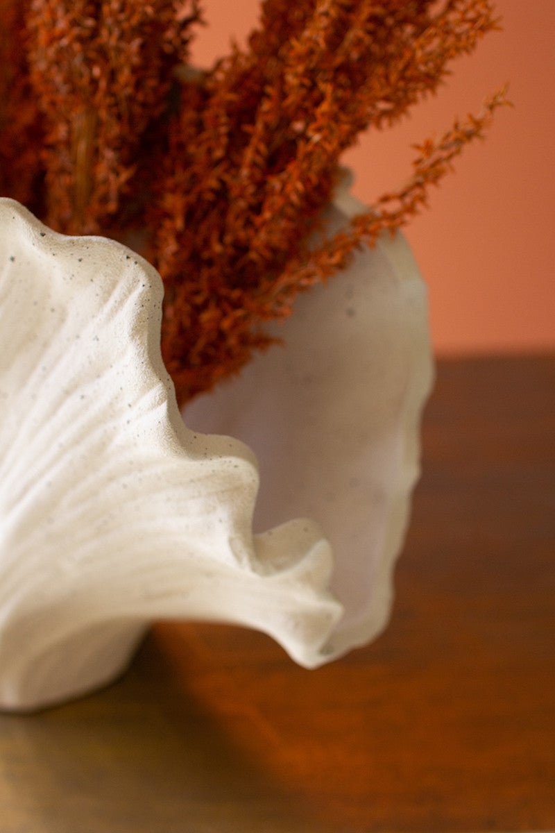 white-coral-vase-with-orange-flowers