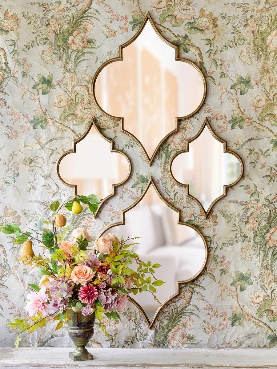 set-of-four-mirrors-on-wallpaper-wall-with-flowers