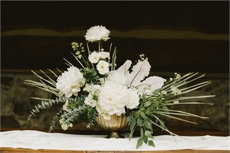 gold scallop edge compote vase with white peonies green eucalyptus 