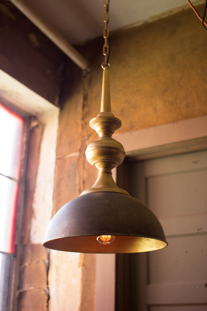 hanging metal pendent lamp near a window