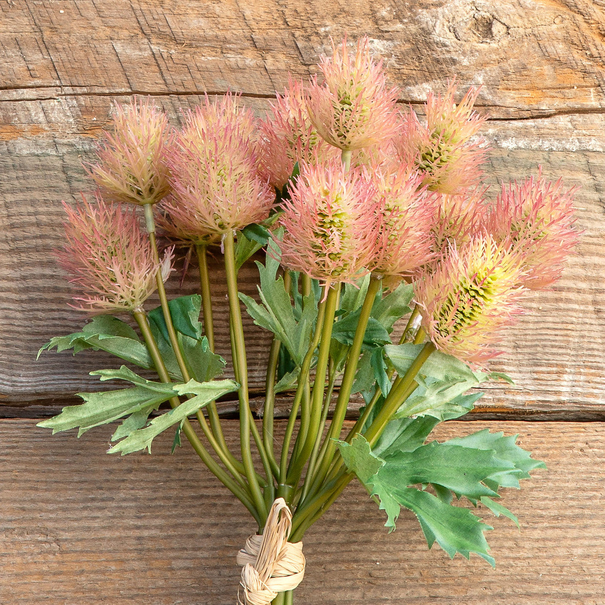 artificial-faux-thistle-flower-on-wood-table
