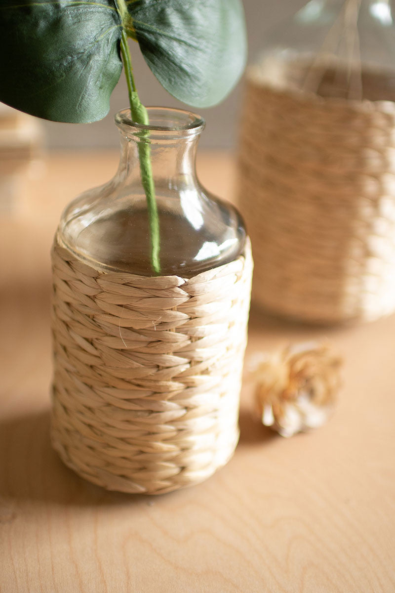 seagrass wrapped clear vase with leaf stem