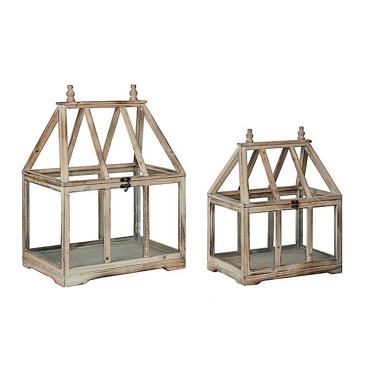 two wood and glass terrariums in different sizes on white background